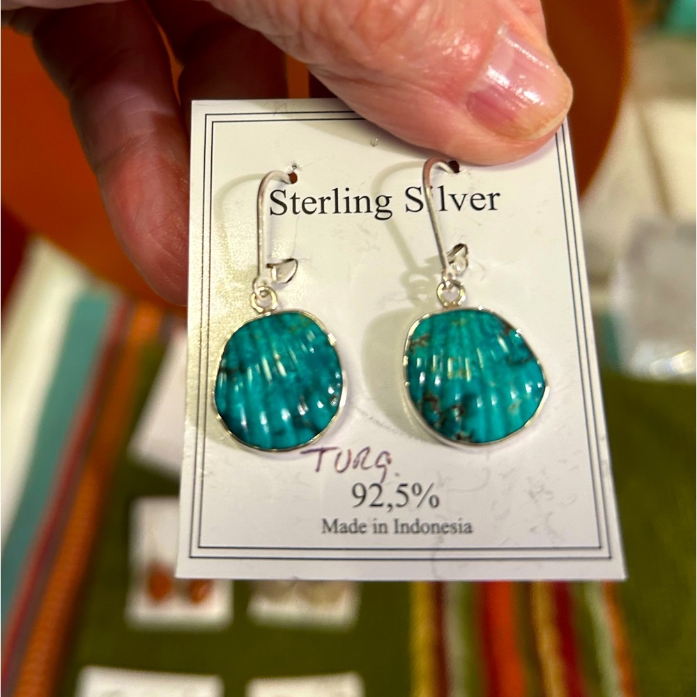 Turquoise carved into a shell sterling silver earrings